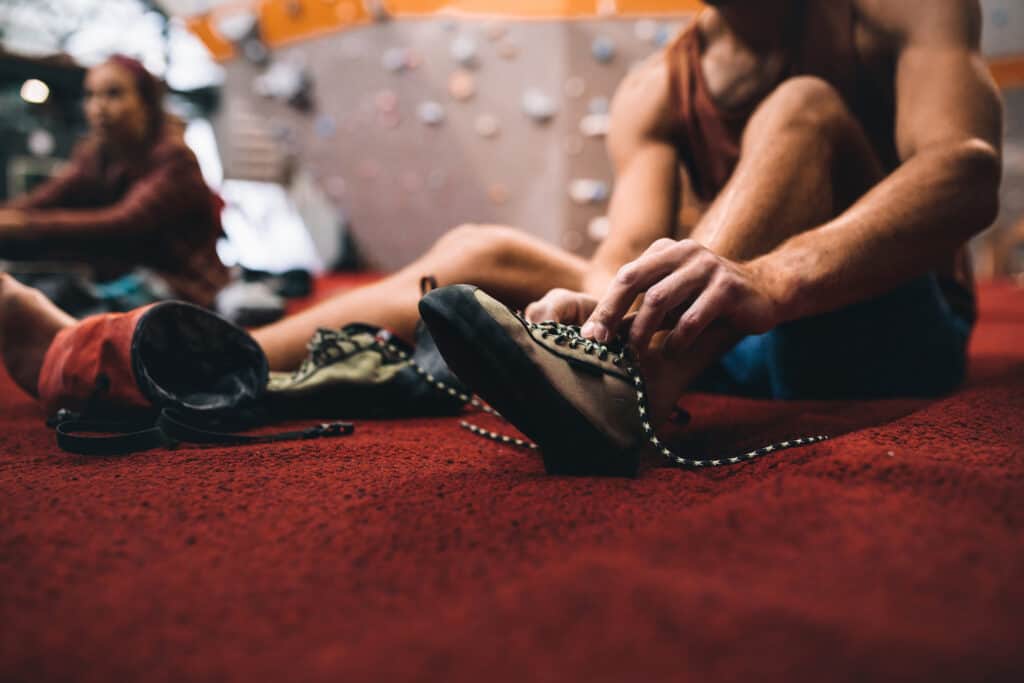 climber putting on shoes
