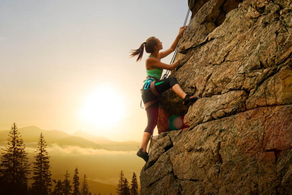 female climber sunset