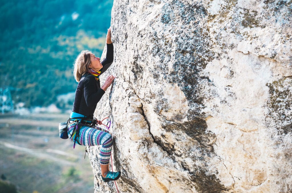 women climbing chalk bag steep ascent