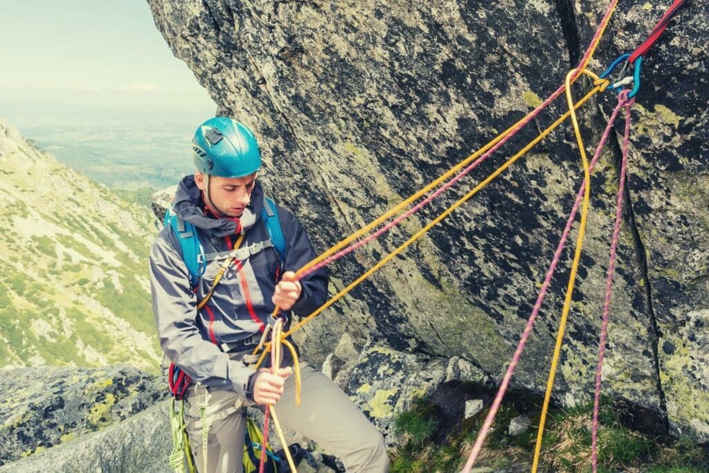 Belayer with rope secured overhead