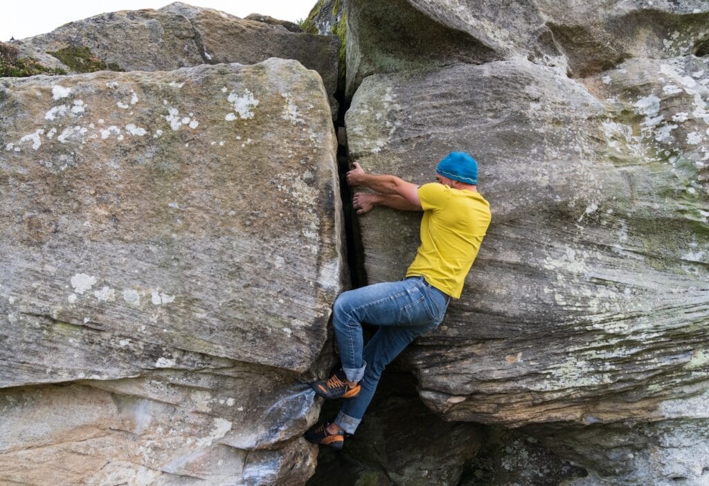 go bouldering in the crack of natural rock