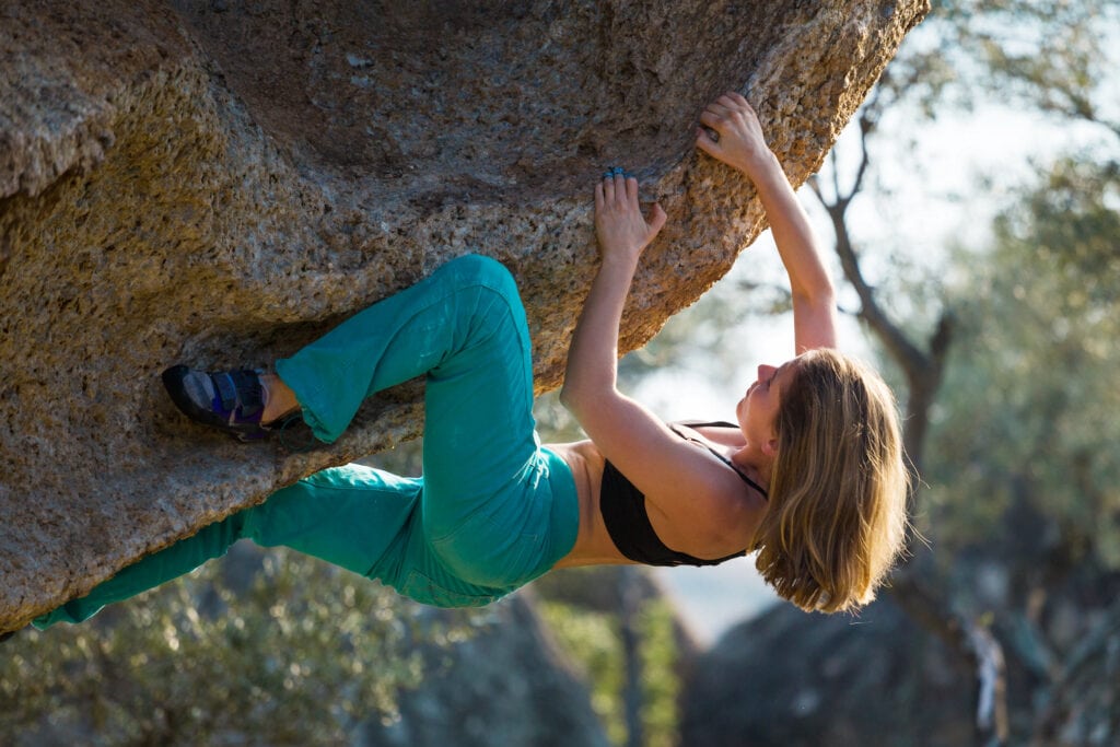 female athlete bouldering session