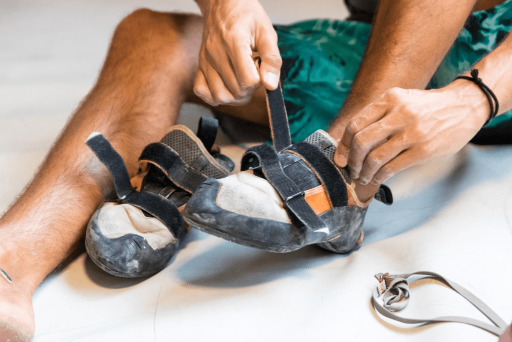 Climber shows how to put on and stretch shoes