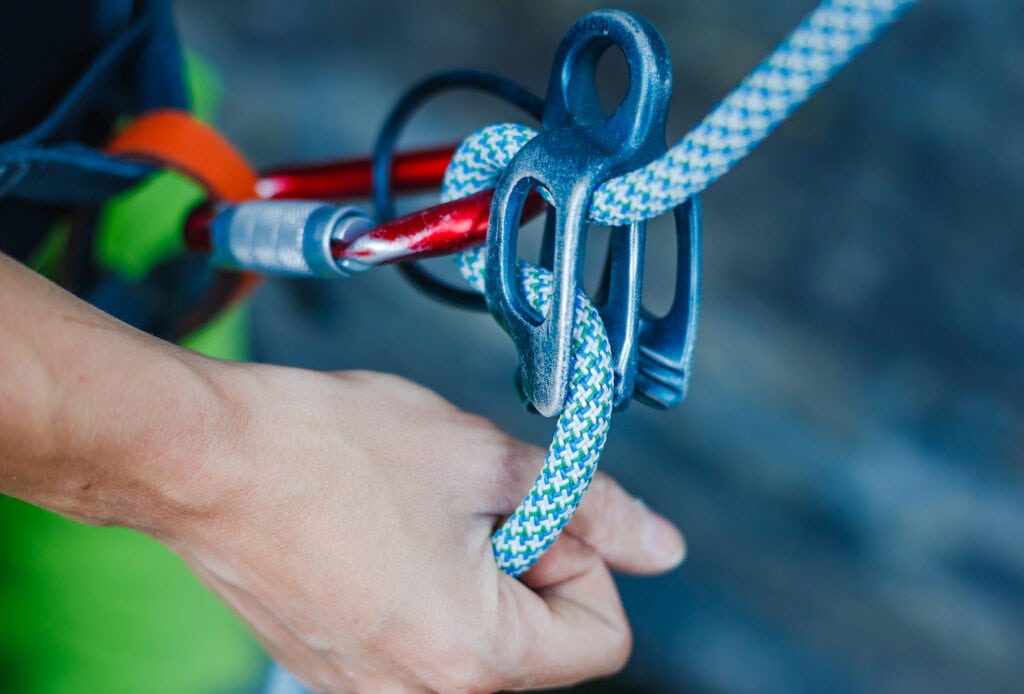 rock climber with belaying equipment