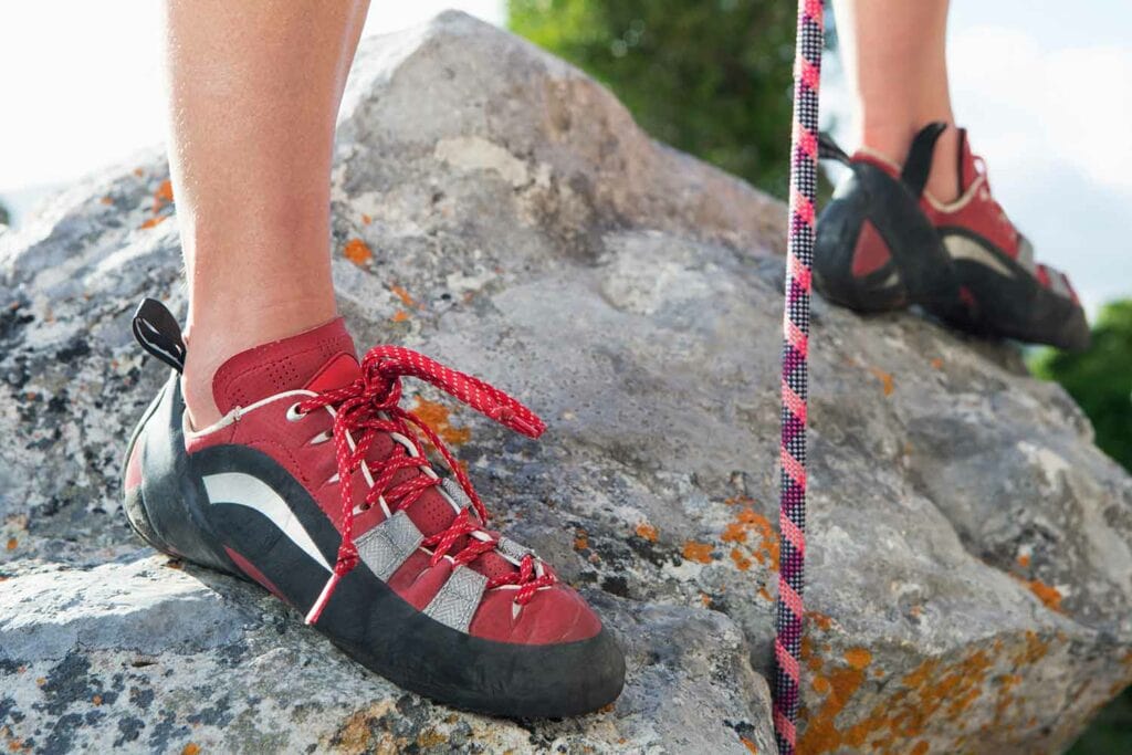red and black woman climbing shoes