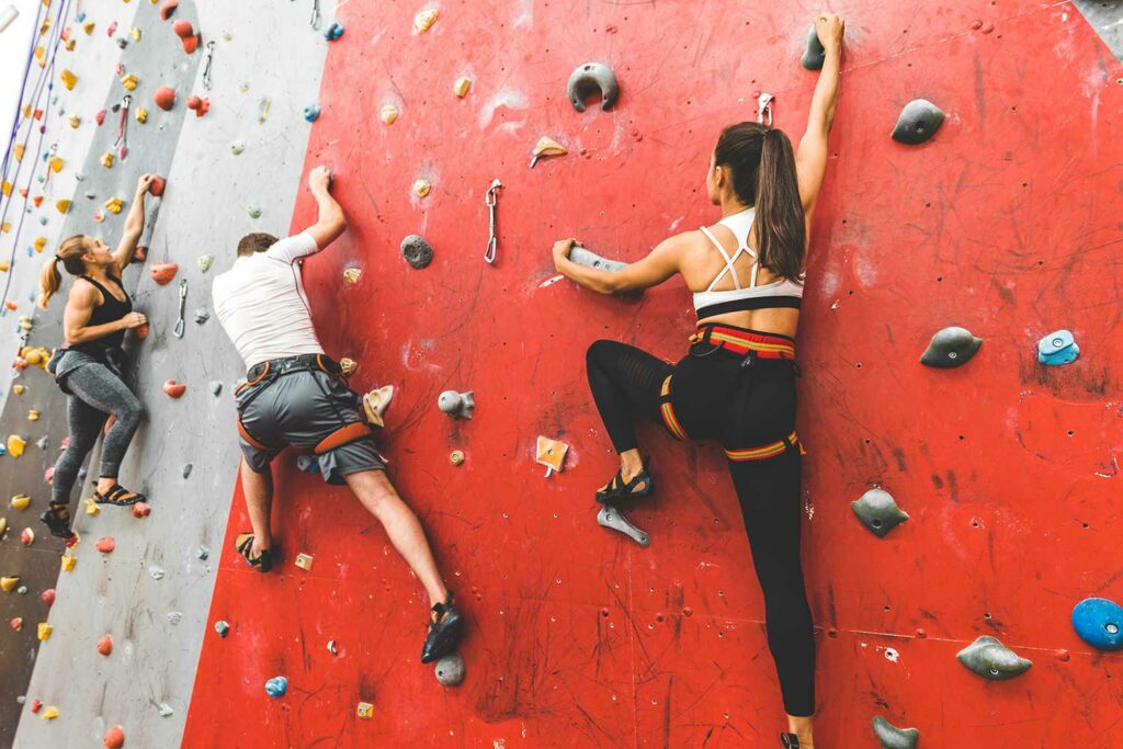 friends in a climbing gym