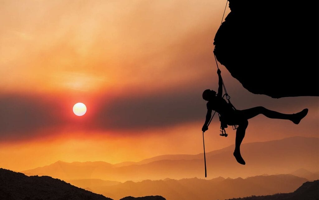 elite climber athlete at sunset