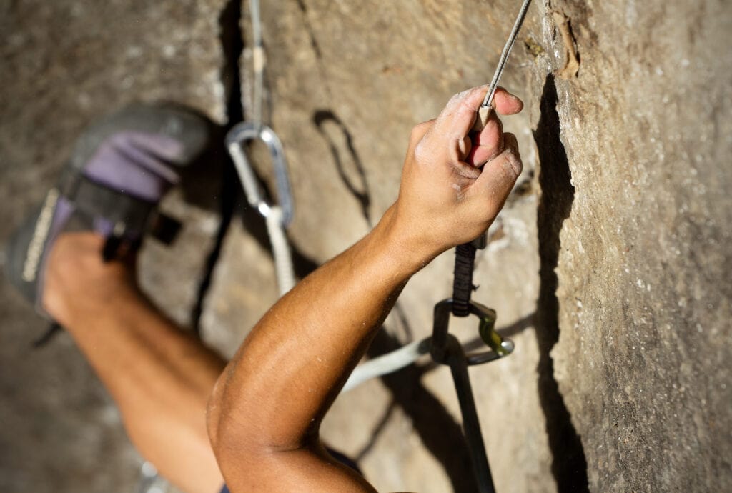 climber on pre bolted climbing routes (sport crags)