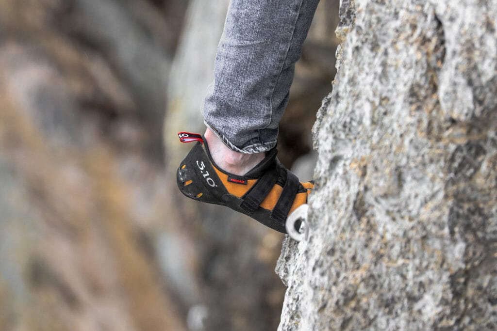 Climber on his toes (edging)