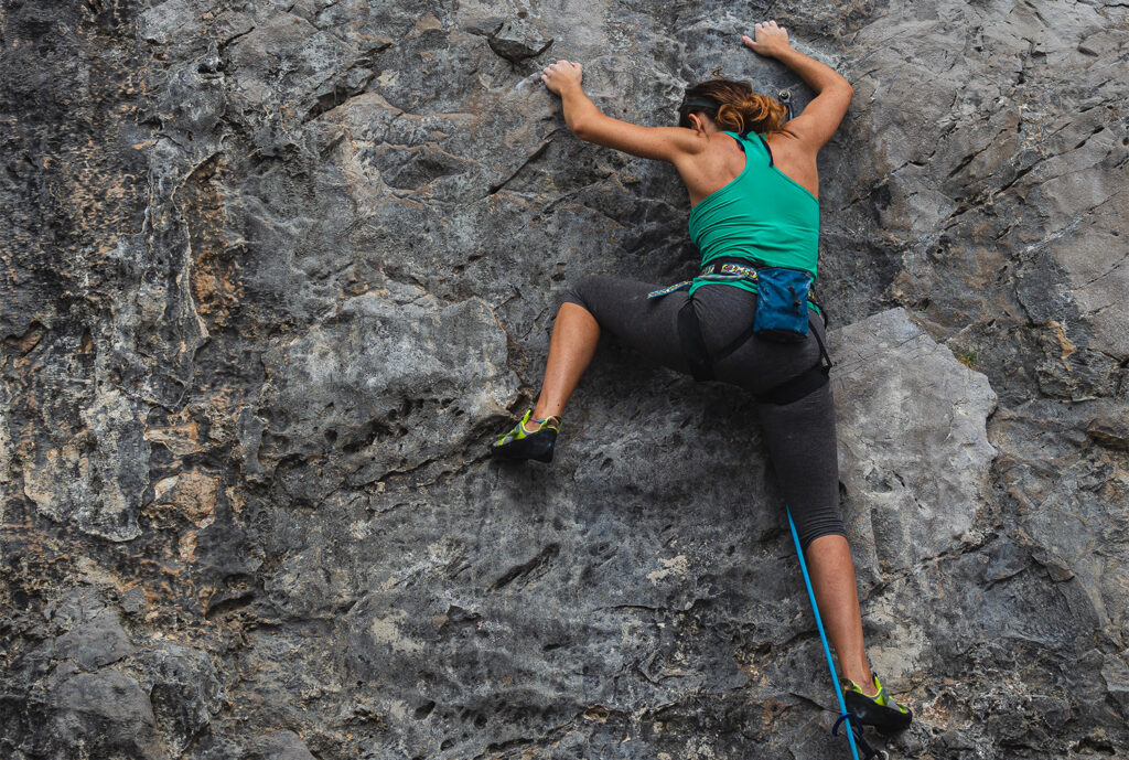 woman rock climbing 