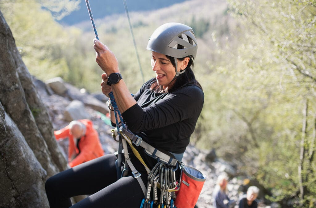 women climbing outdoors
