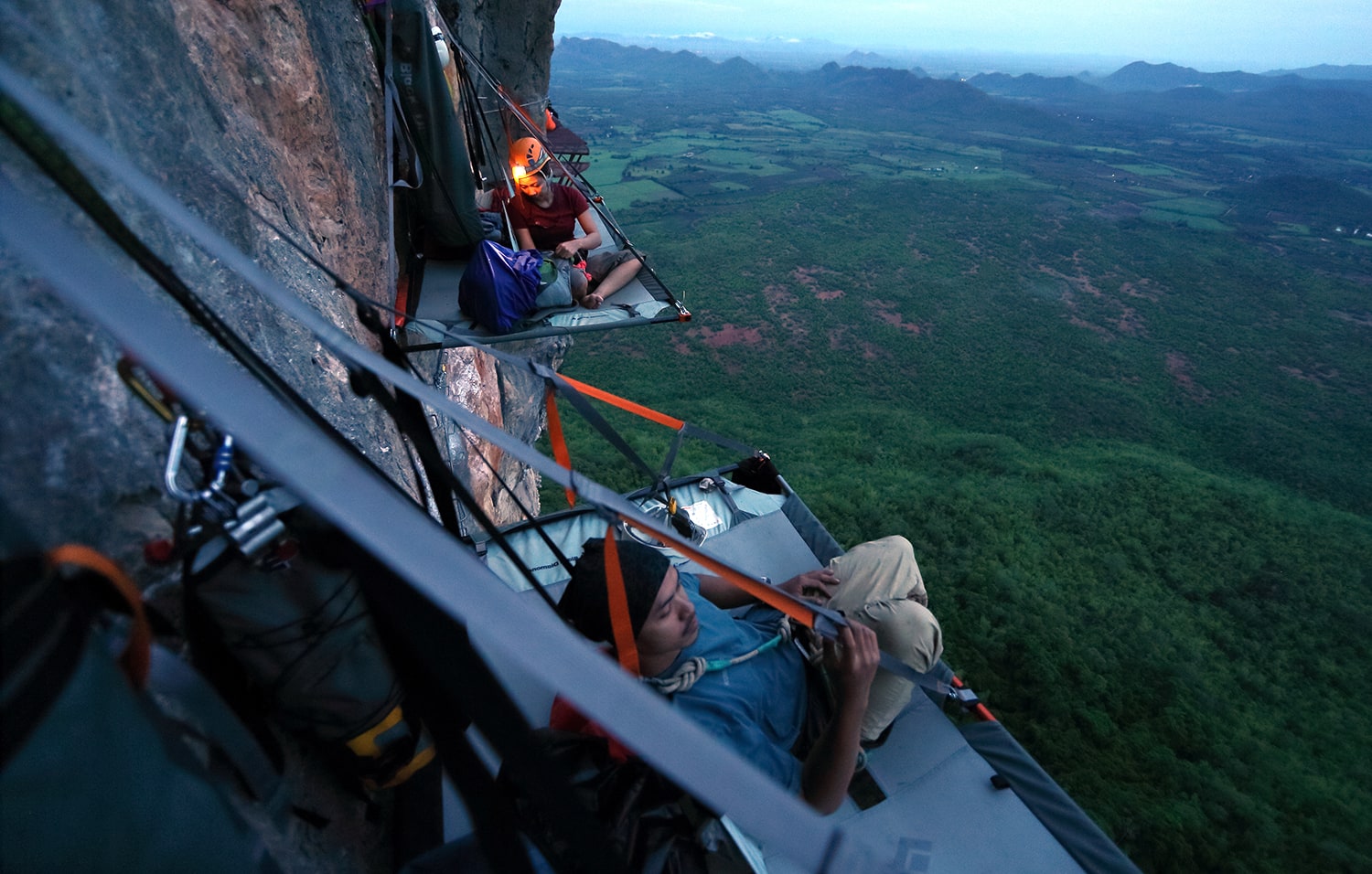 climbers on a cliff inside the portaledge