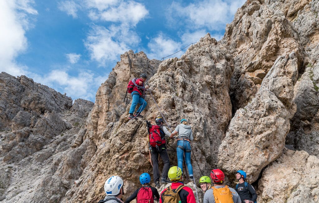 rock climbing guide leading a group of climbers