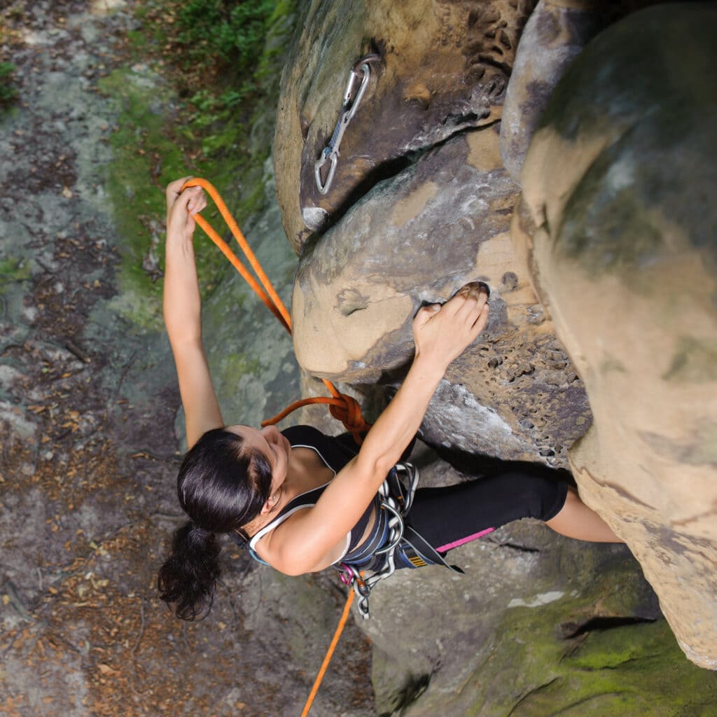 climber clipping into a quickdraw
