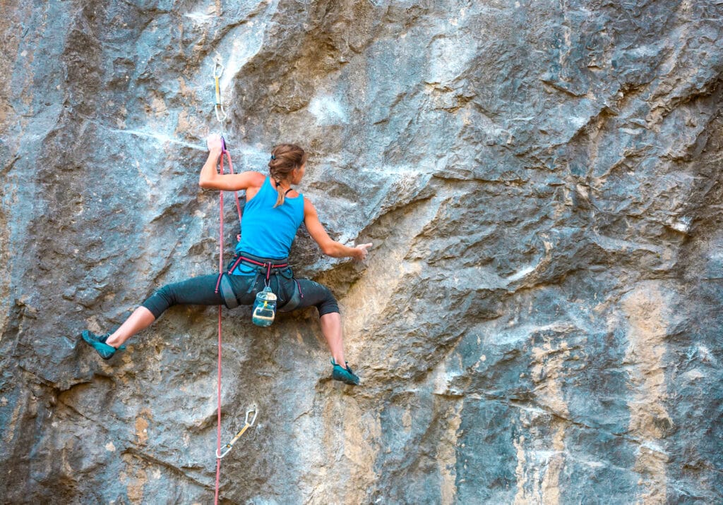 competition lead climber progressing on granite