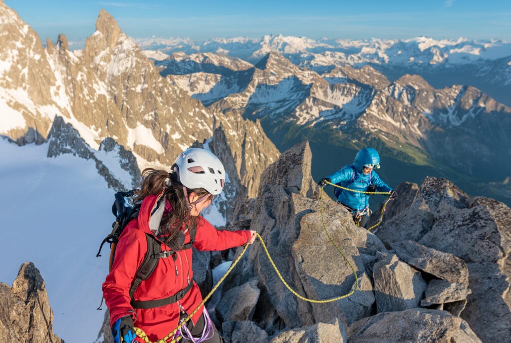 climbers climbing on mountain ridge
