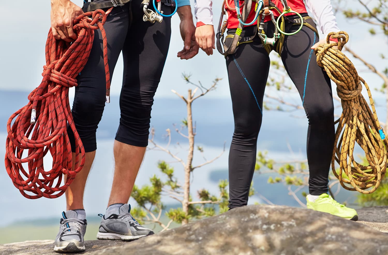 couple carrying climbing ropes