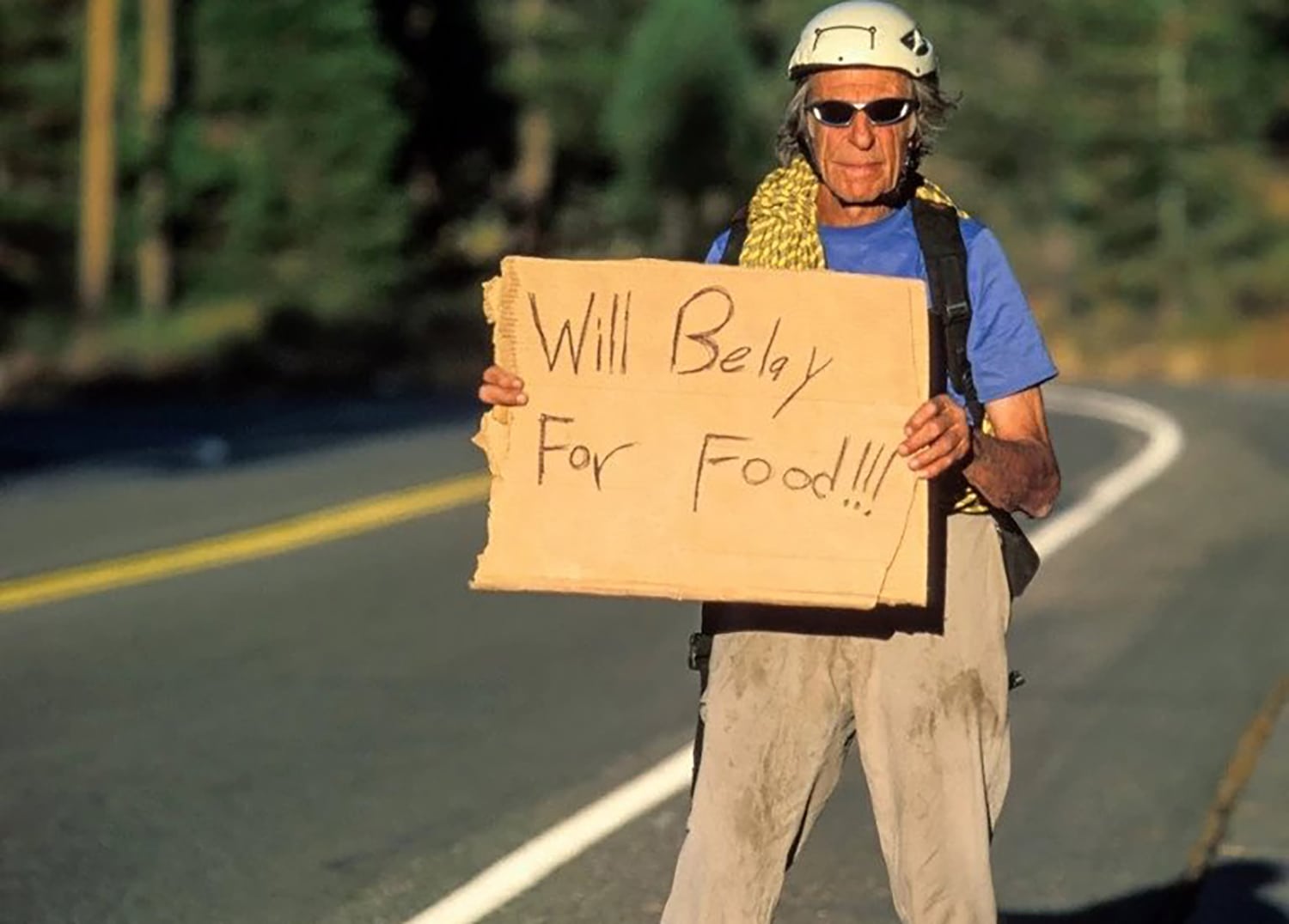 Fred Beckey hitchhiking along Highway 50
