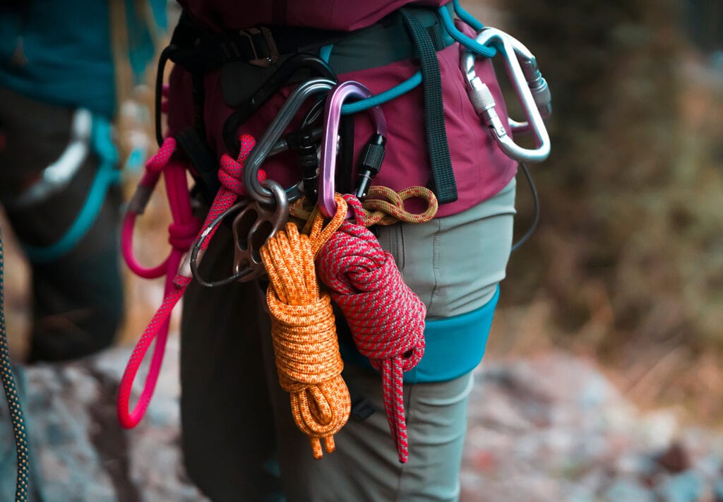 climber wearing climbing harness and ropes