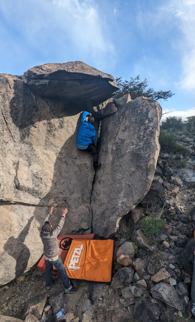 boulderer and spotter with Petzl Alto for protection