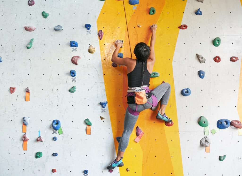 climber practicing on a route indoor