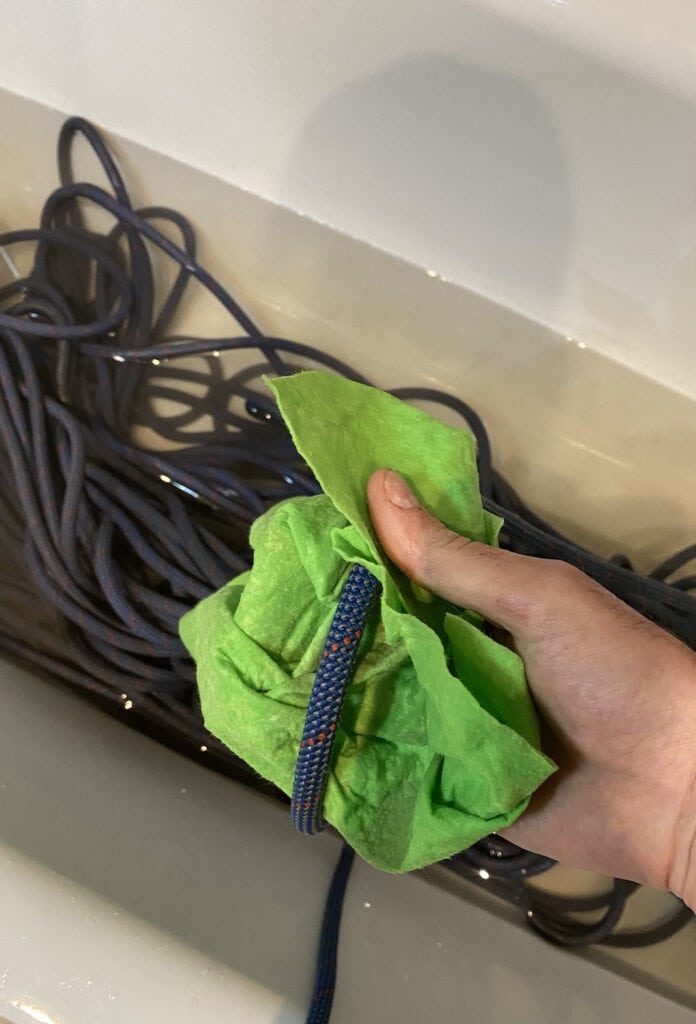 cleaning the rope with a rag