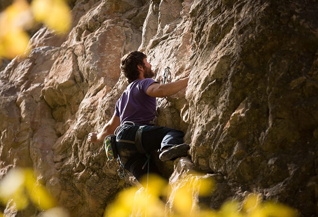 man rock climbing in Rifle Mountain Park