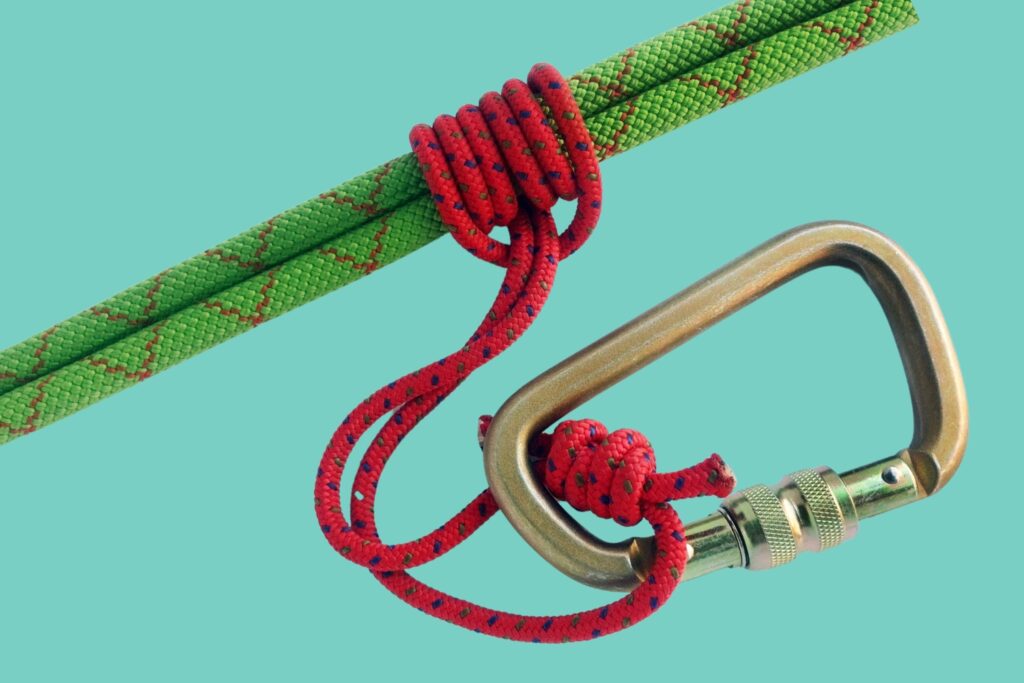 Prussik knot on a rope with a carabiner. The cord loop provides friction to tighten easily