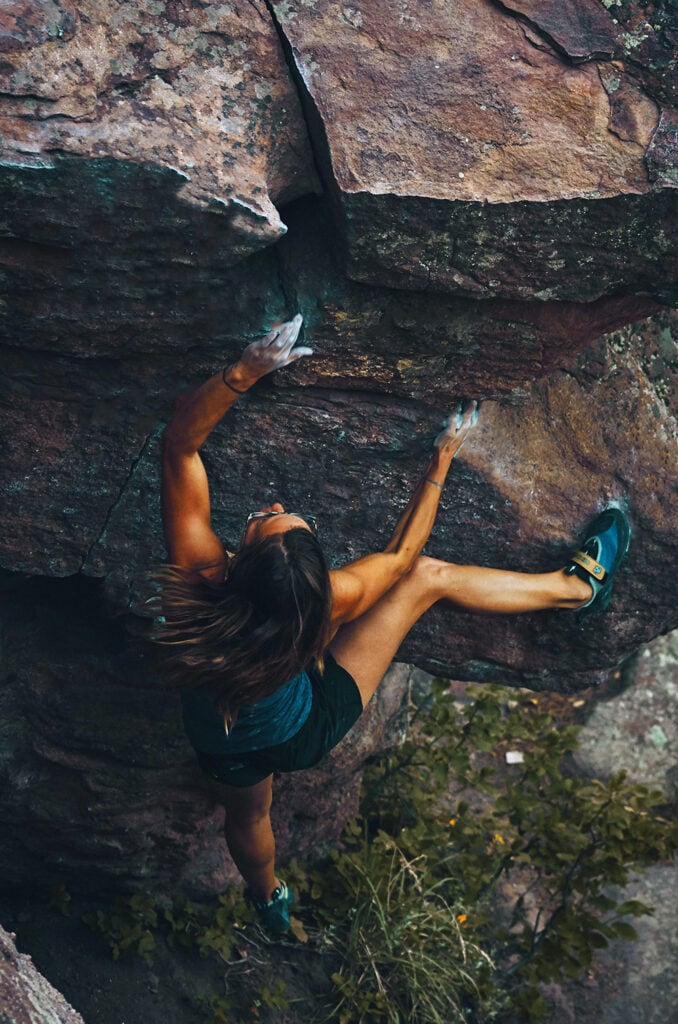 Rock climber outdoors with chalk on hands