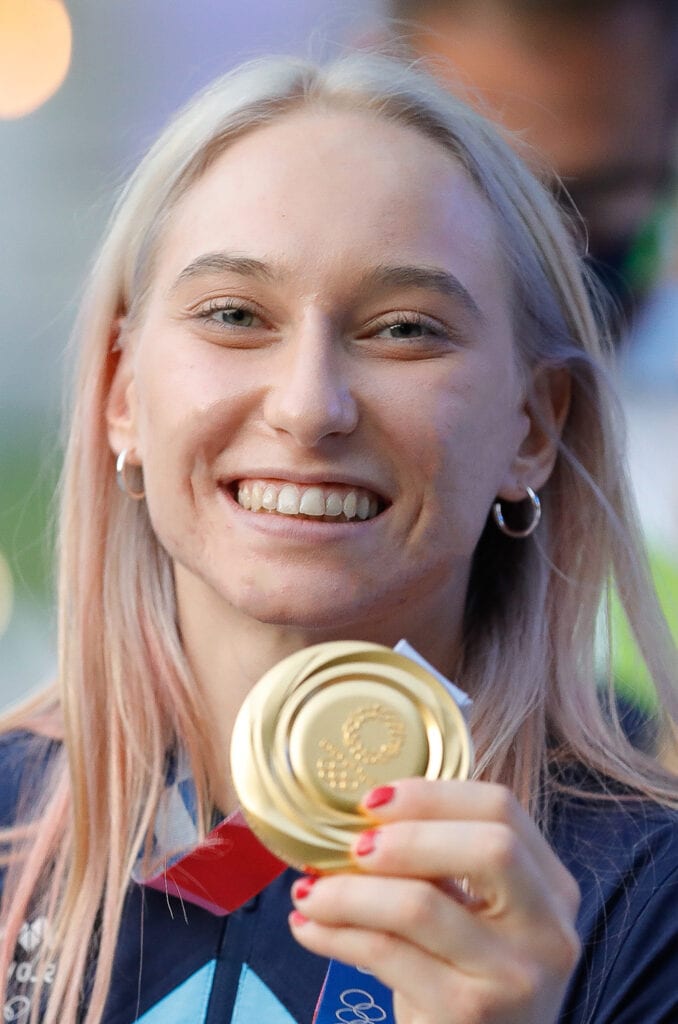 Janja Garnbret holding a gold medal after winning the women's combined at the Tokyo Olympic games
