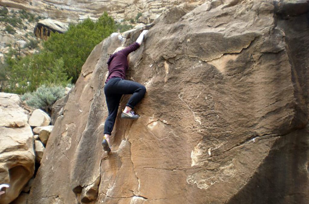 woman bouldering in Joe's Valley, Utah