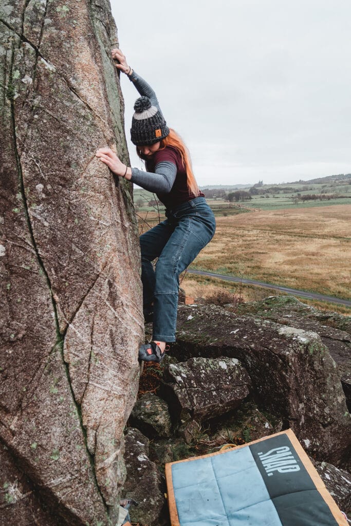 female climber on a boulder