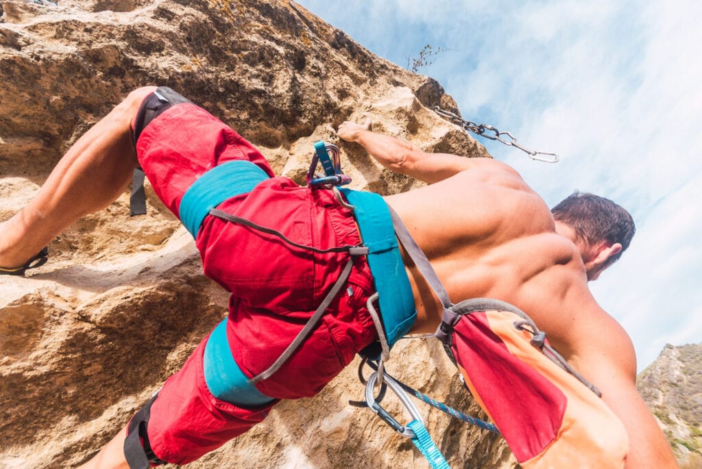 rock climber with blue harness