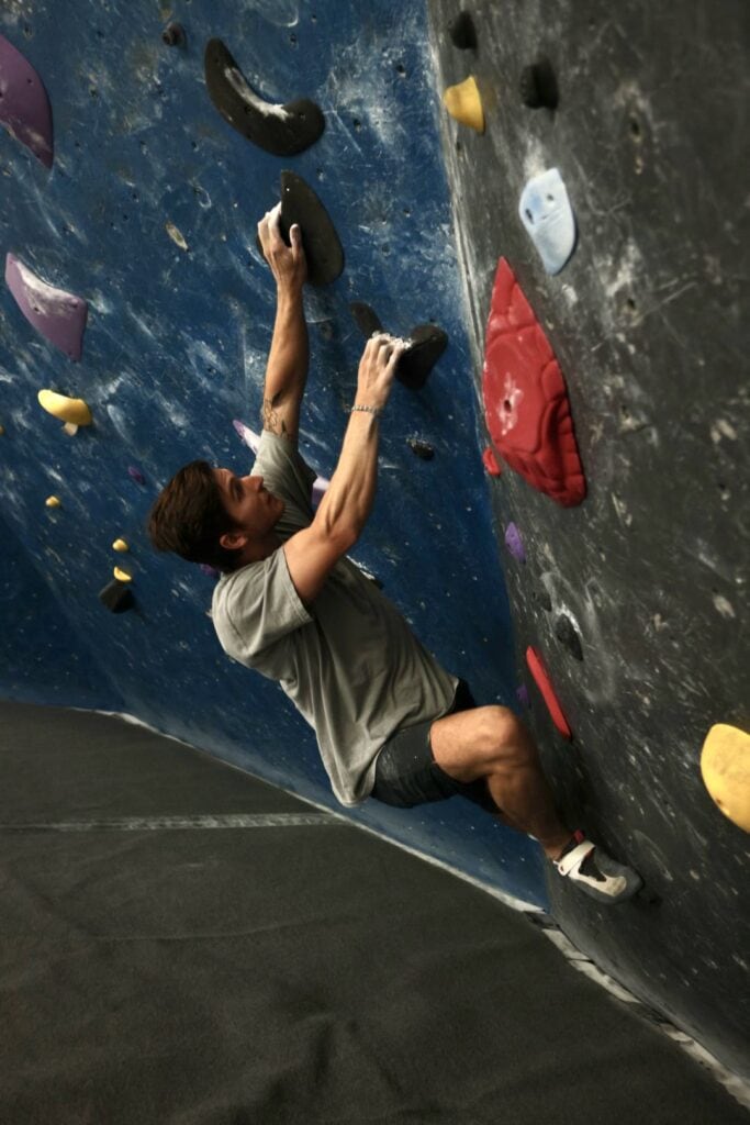 head routesetter bouldering to test a new problem at the refuge climbing gym in las vegas