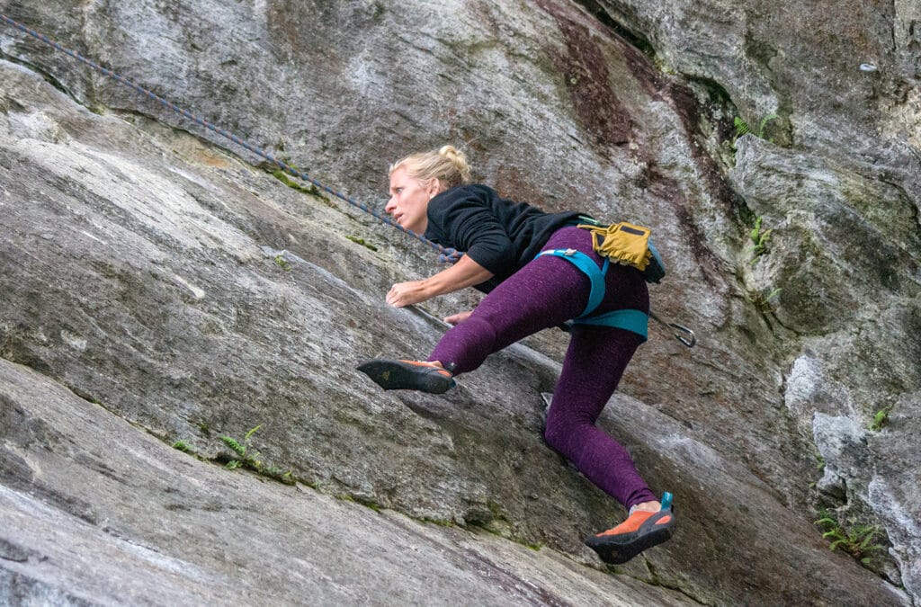 female rock climber on Clip a Dee Doo Dah multi pitch spot in, Rumney, New Hampshire