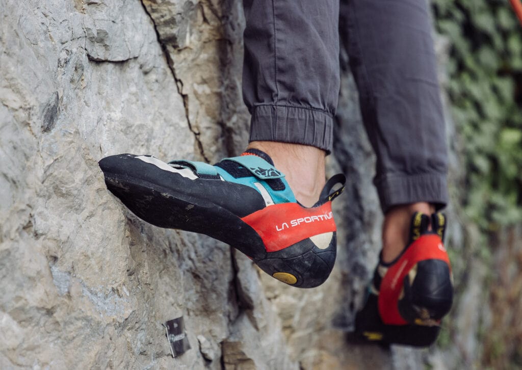 climbers using their left shoe to edge on a tiny hold