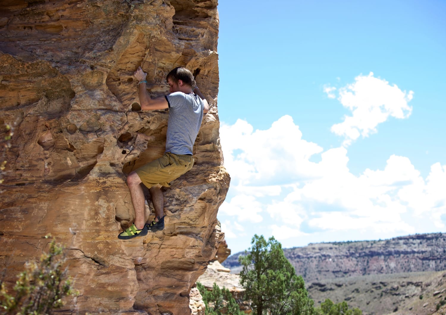 male climber bouldering in Colorado